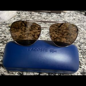 Original and authentic Lacoste Aviator L177S 003 sunglasses. Silver with brown